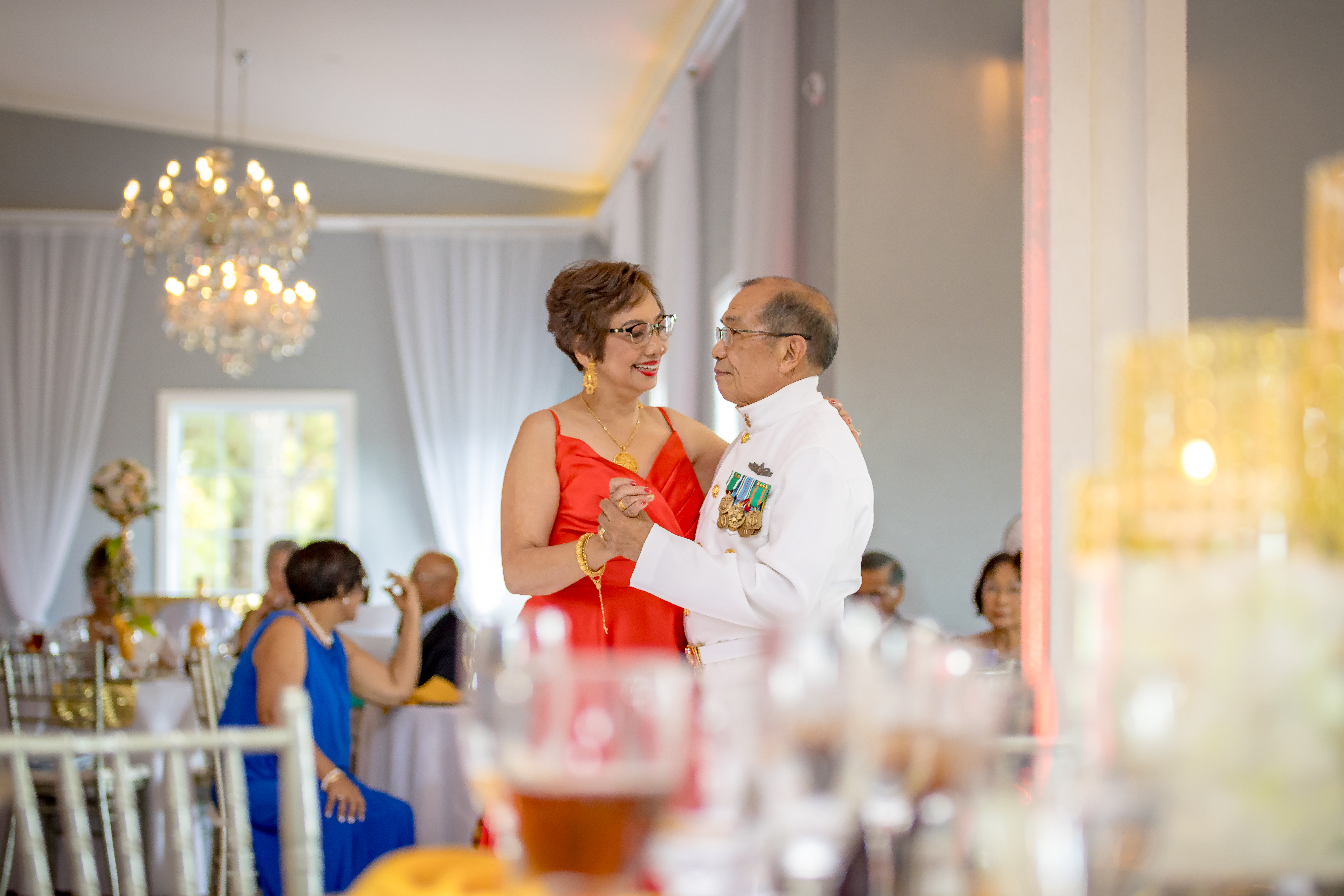 Groom smiling affectionately at his bride